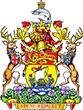 A drawing of the New Brunswick coat of arms. There is a crest featuring a boat and a lion, with a deer standing on its hind legs on each side of the crest and a fish above.